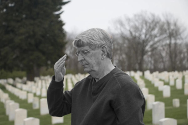 CW3 (Ret.) Denny Hart salutes during a Camp Nelson ceremony